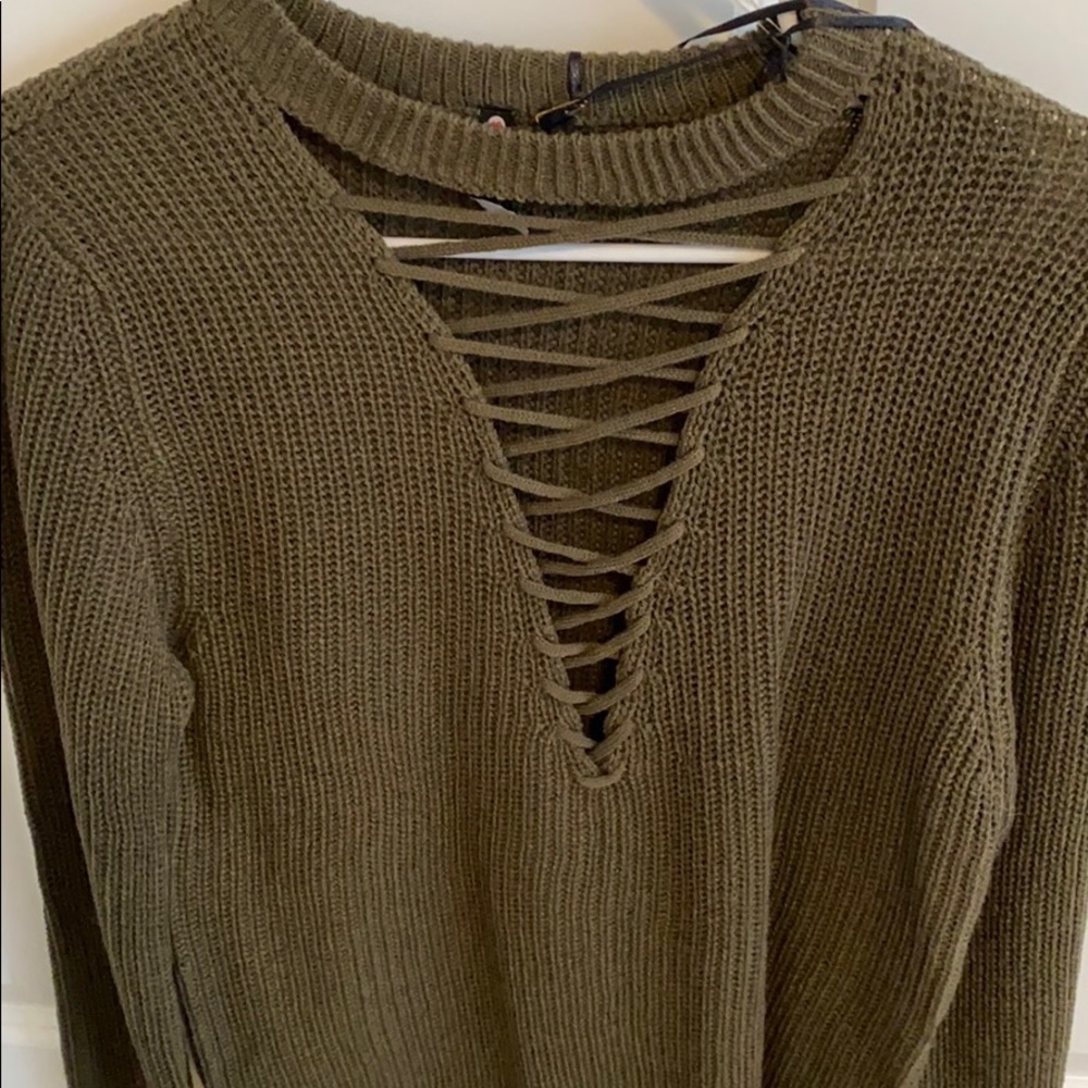Brand new cross front sweater